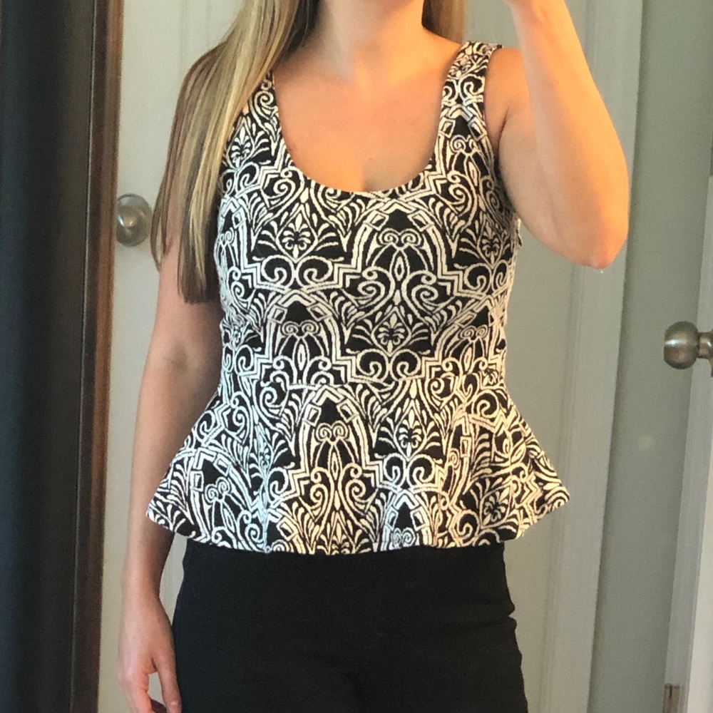 Bebe Black and white patterned peplum top